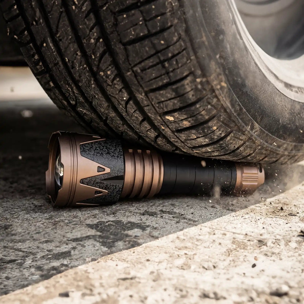 Durable 2000J flashlight tested under a vehicle tire